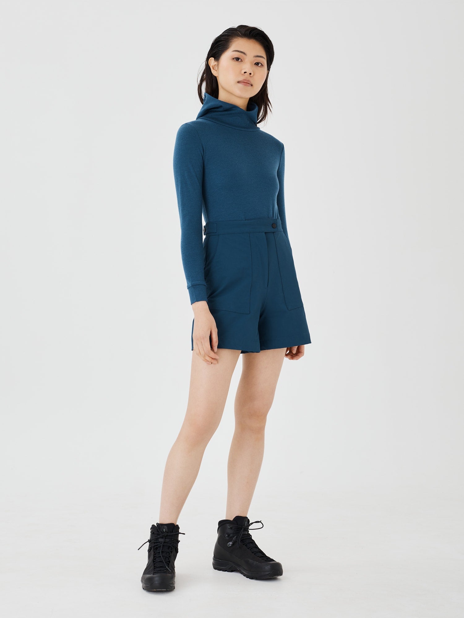 Front view of a women's blue merino wool hoodie by Šumska, featuring a slim and comfortable fit with premium fabric.