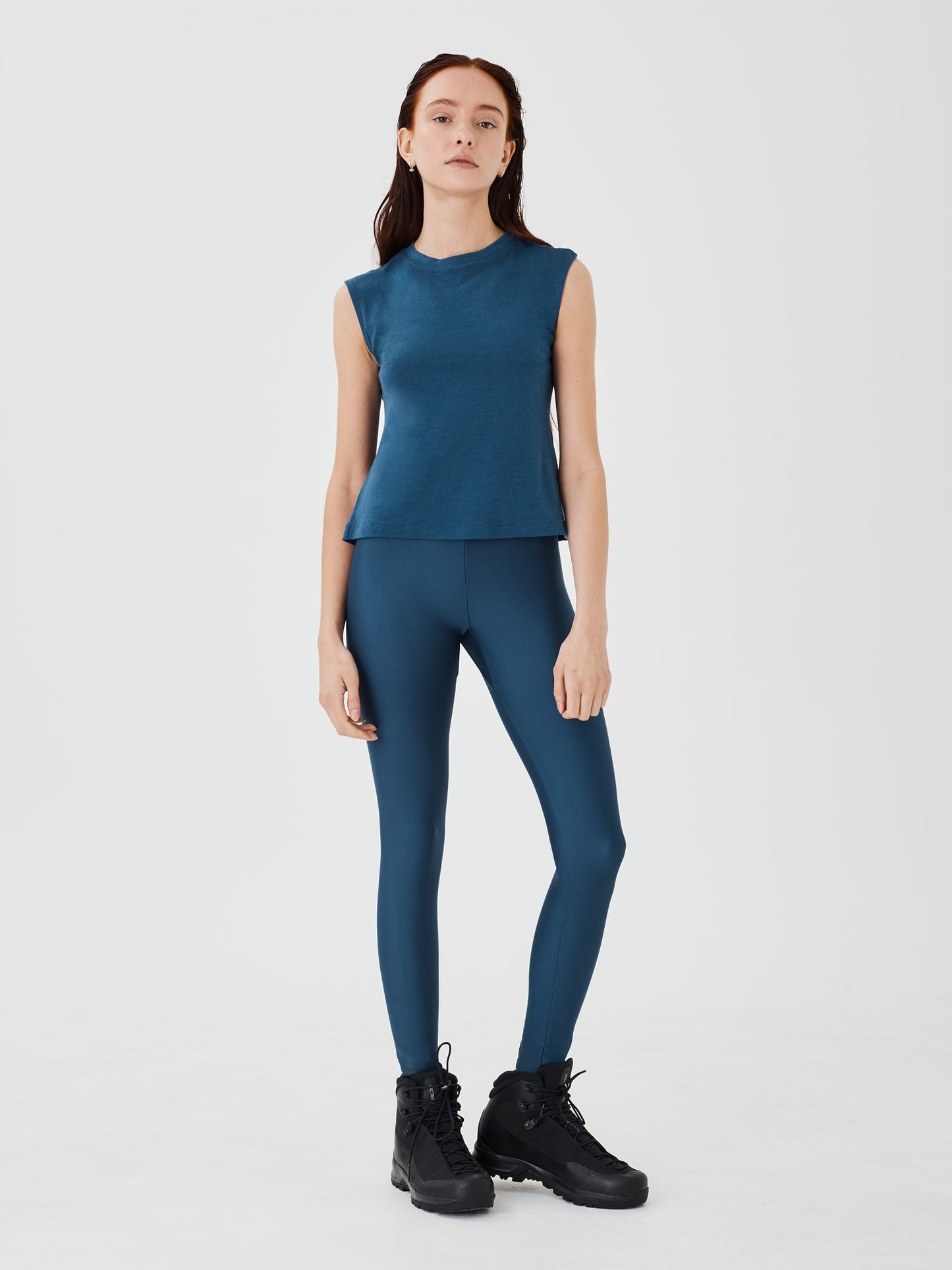 Front view of a women's blue merino wool sleeveless T-shirt by Šumska, featuring a comfortable and lightweight design.