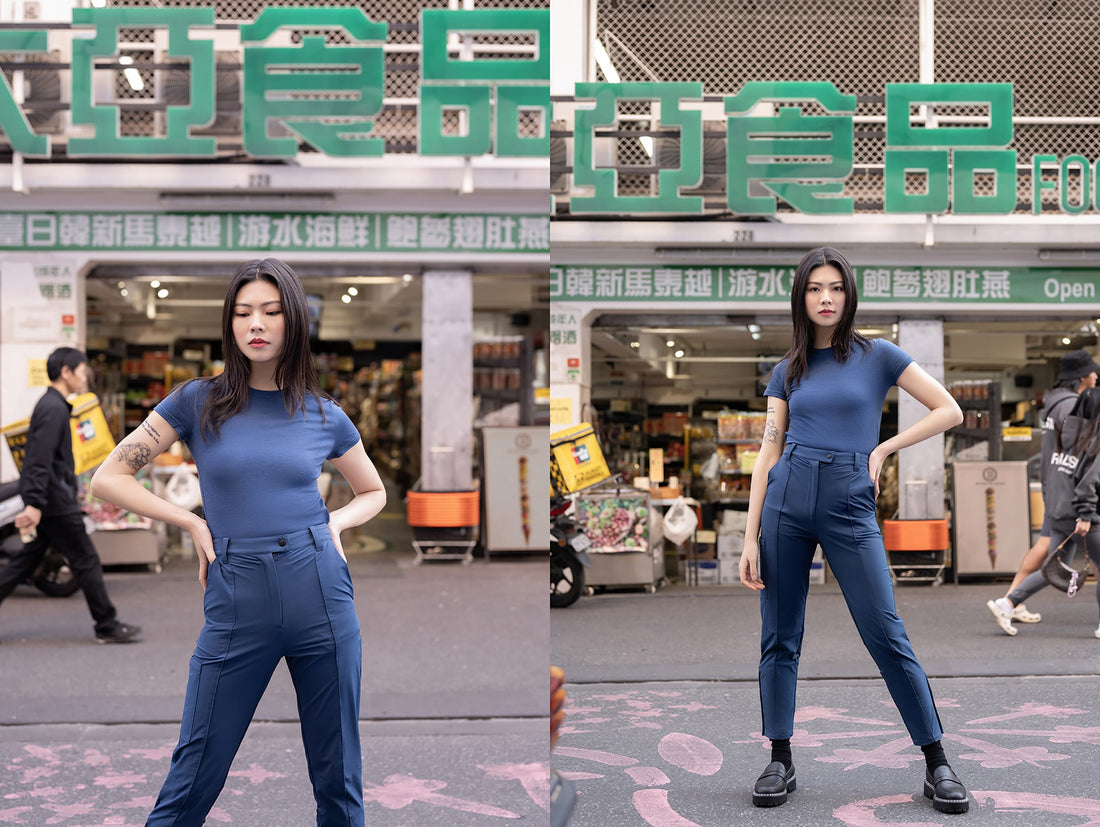 A woman in the city wearing a navy Merino t-shirt paired with hiking pants.