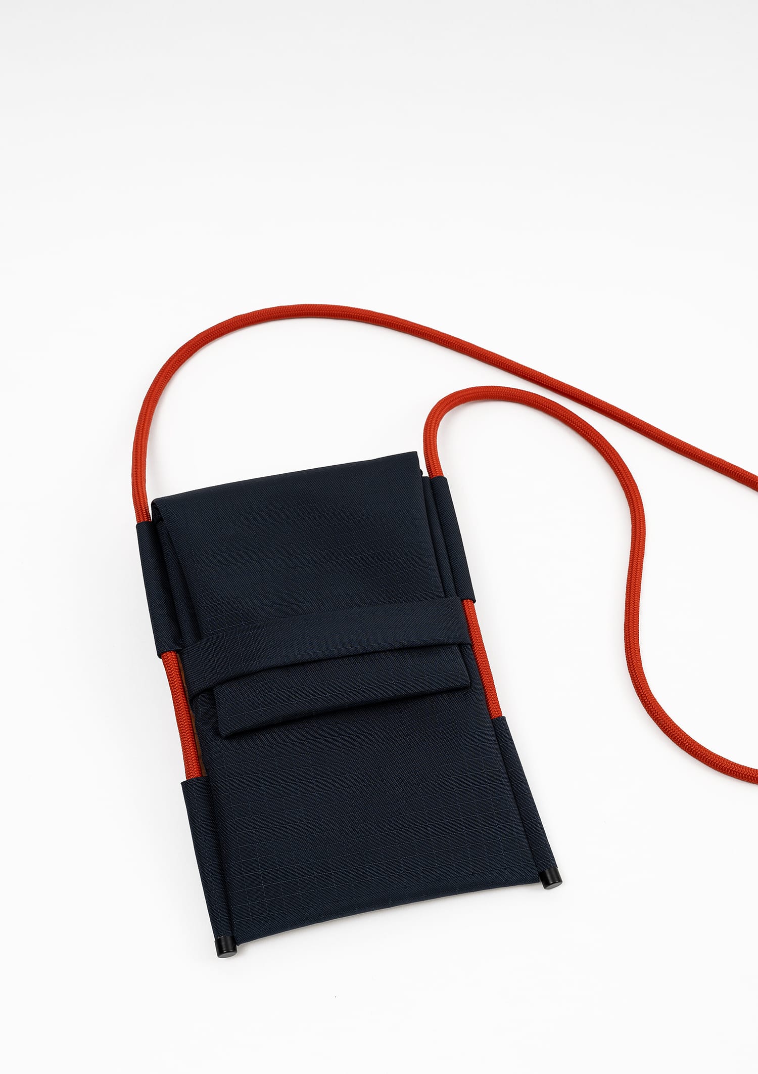 Front view of the Šumska Cordura Crossbody iPhone Bag, featuring a durable design with a solar orange Paracord rope strap, perfect for carrying an iPhone and other essentials.