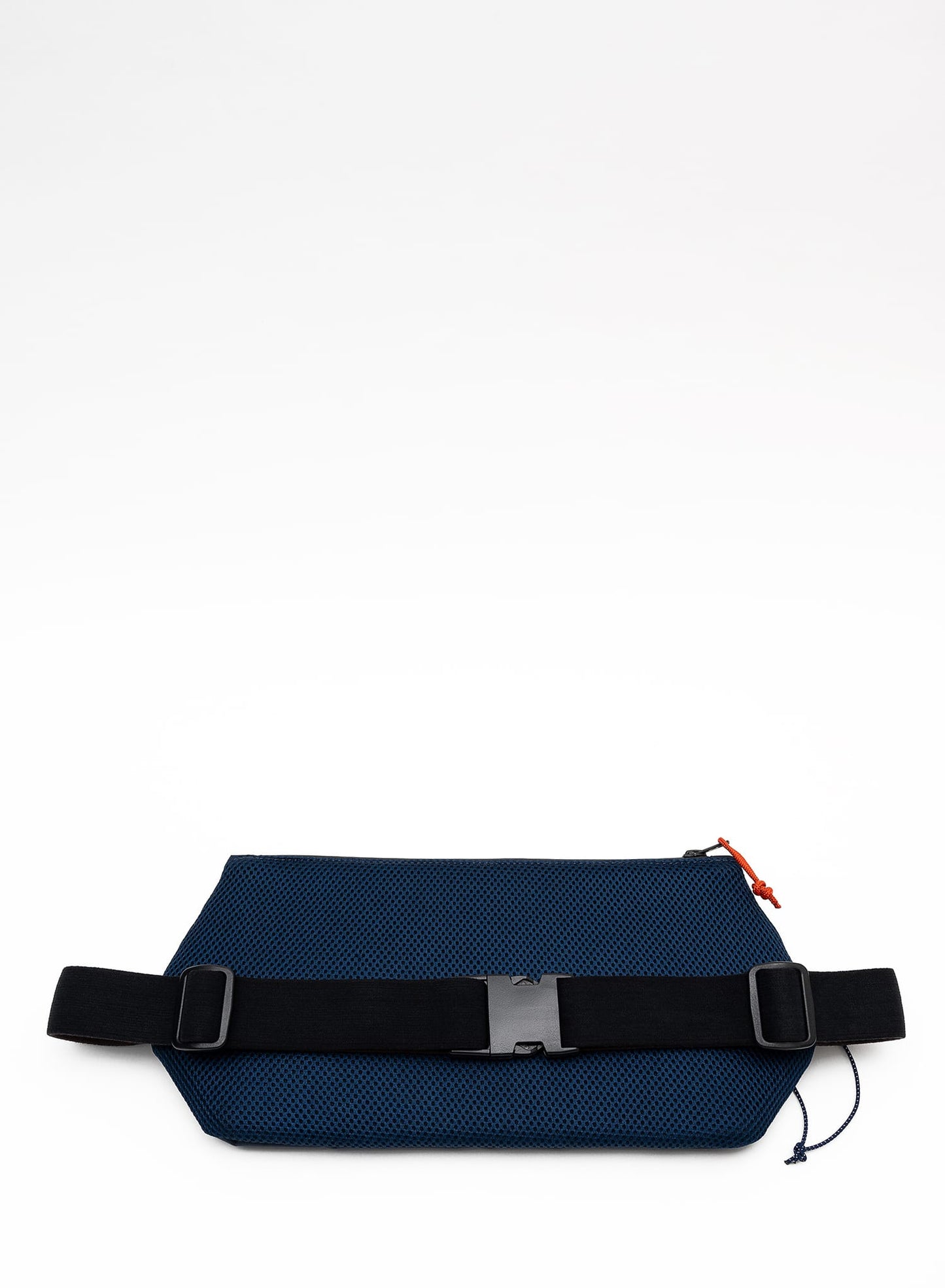 Back view of the Šumska midnight blue Cordura sling bag, featuring a soft 3D mesh backing, black elastic strap, buckle, and adjustable glider for comfort and secure fit.