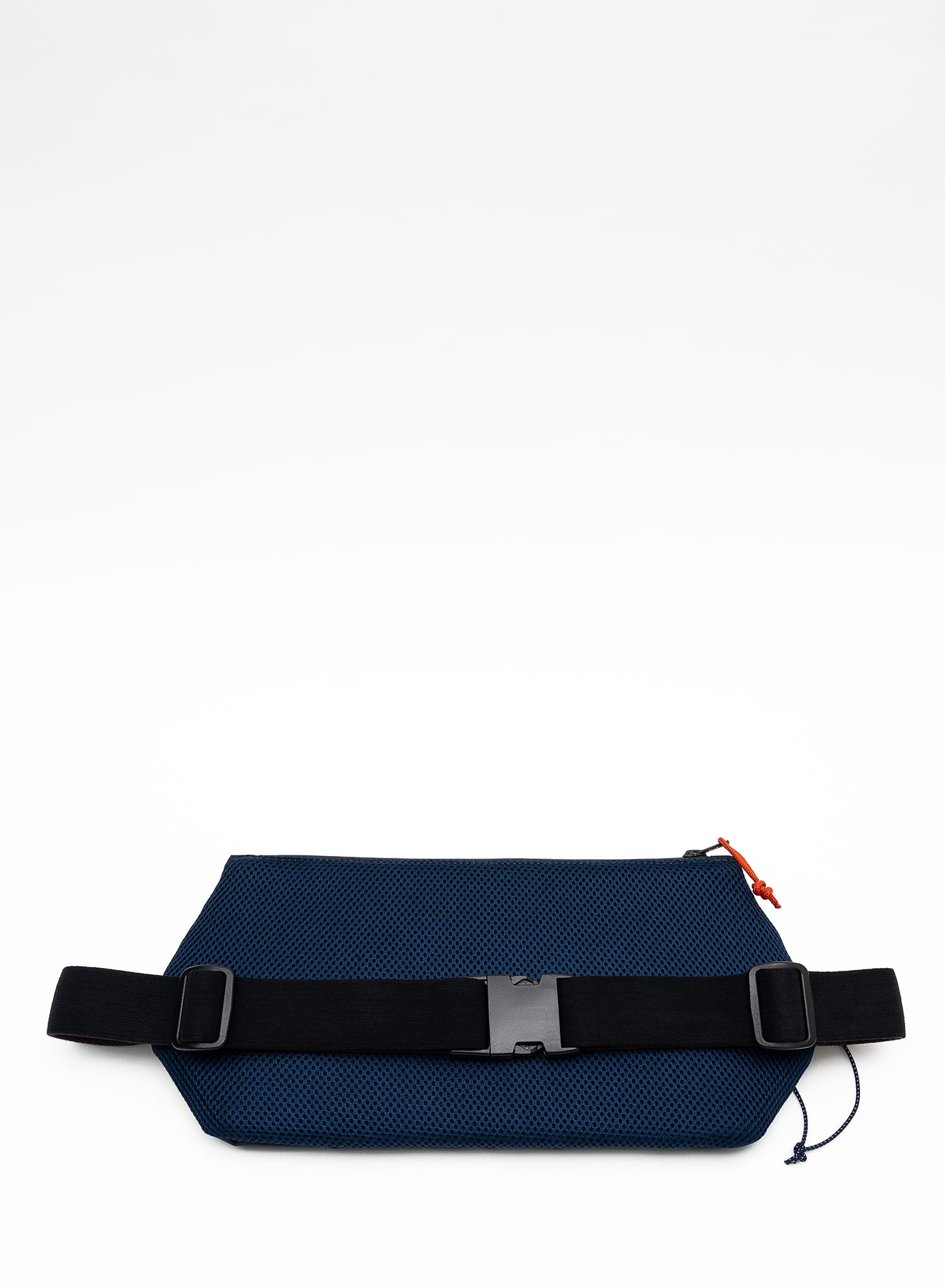 Back view of the Šumska midnight blue Cordura sling bag, featuring a soft 3D mesh backing, black elastic strap, buckle, and adjustable glider for comfort and secure fit.