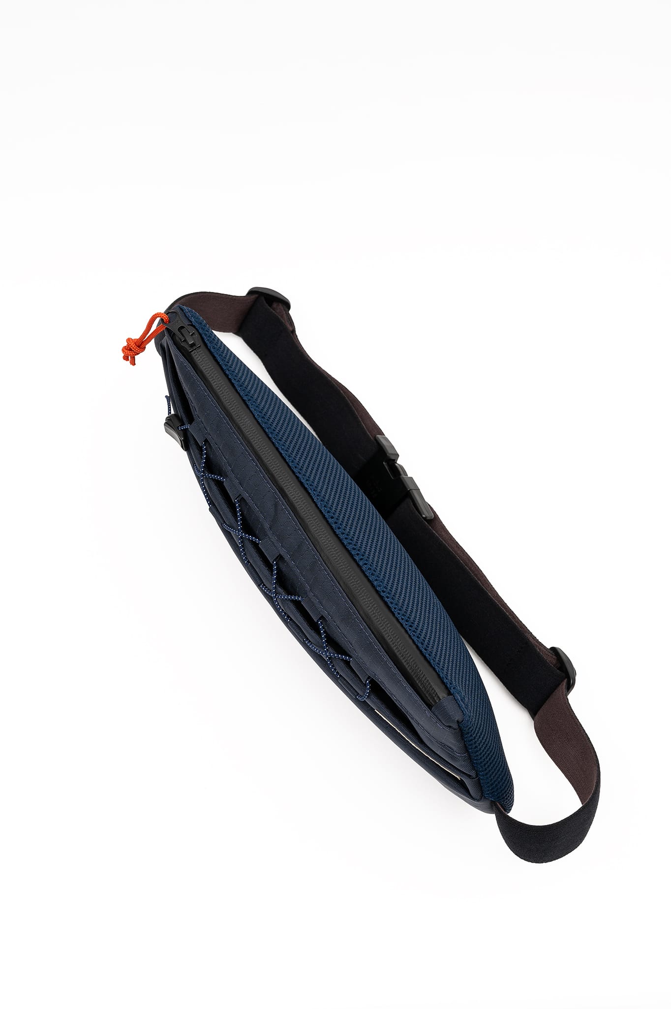 Top view of the Šumska midnight blue Cordura sling bag, showcasing the YKK AquaGuard zipper and vibrant solar orange zip pull cord for waterproof protection.