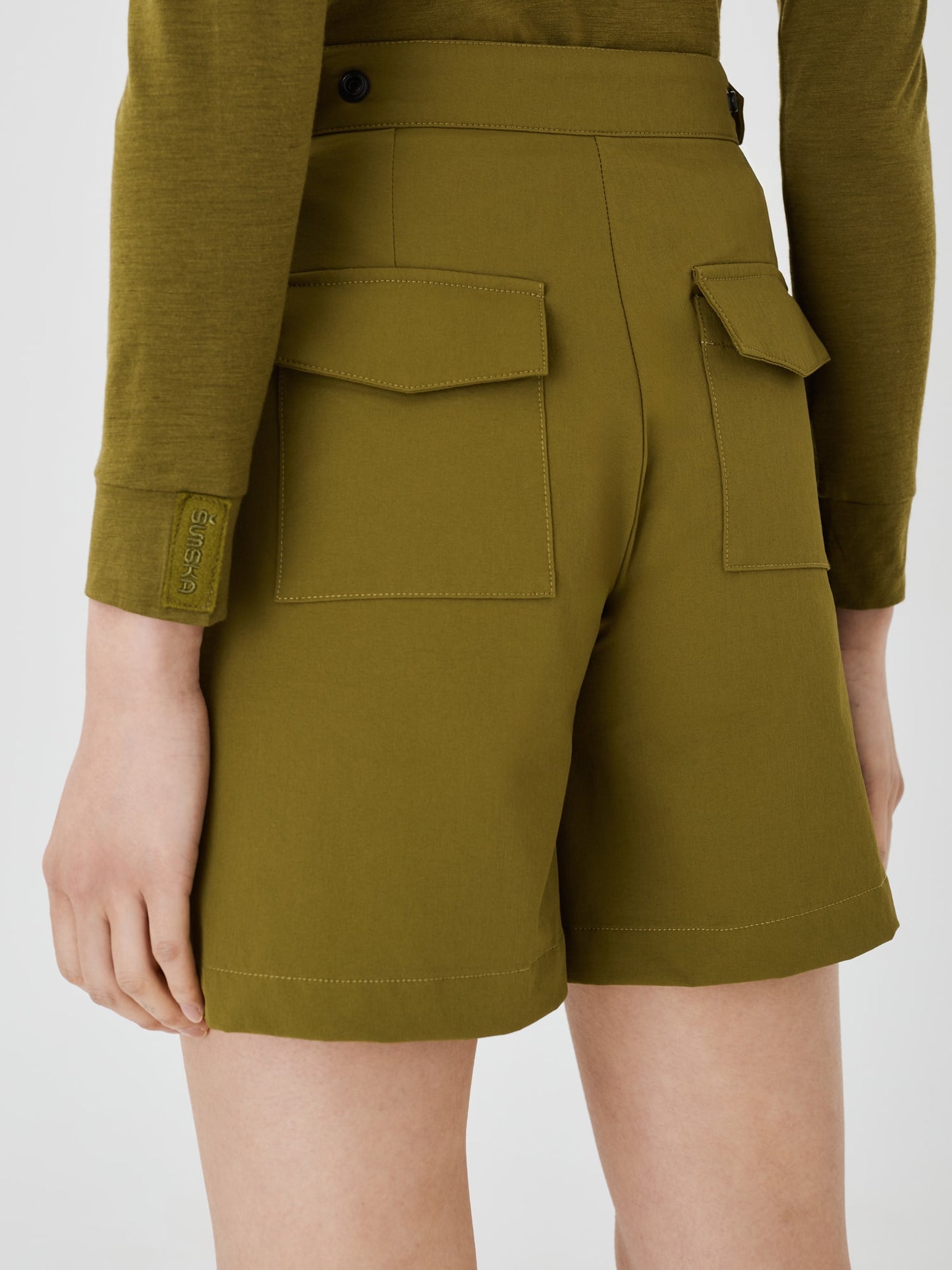 Close-up back view of olive green Softshell Hiking Shorts by Šumska, highlighting the durable fabric and classic design details.